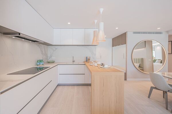Un elegante apartamento de tres dormitorios en la planta baj
